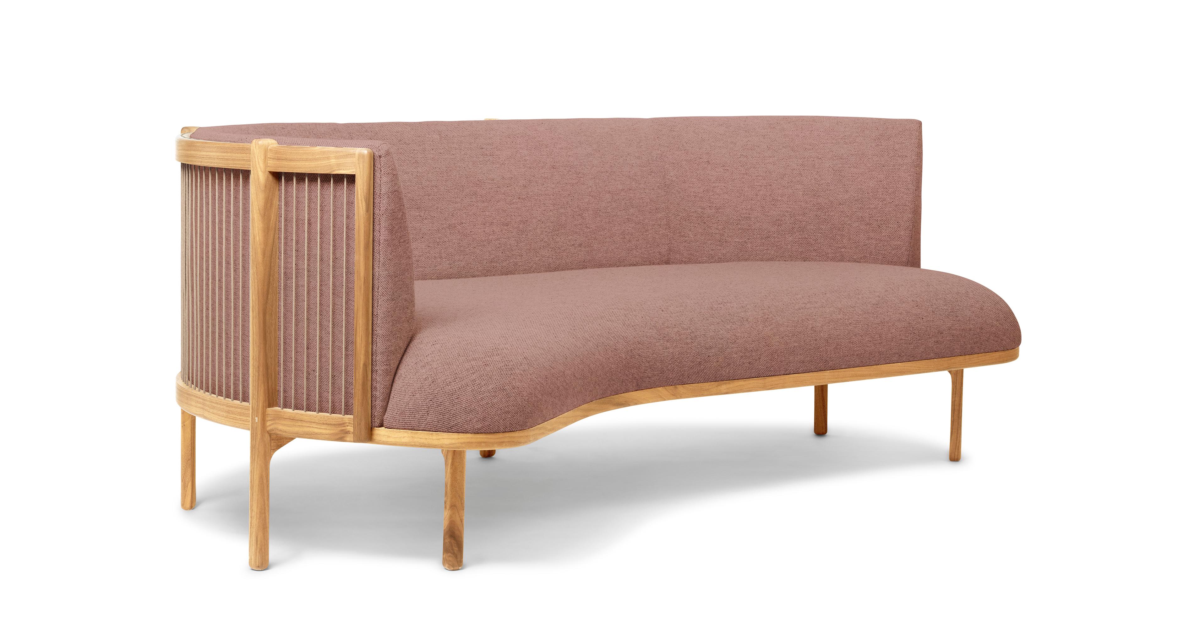 The sideways sofa from Rikke Frost combines Classic materials, wood, paper cord, and high-quality upholstery textile, with a modern asymmetric shape. The steam-bent backrest is shaped from solid wood and woven paper cord for a light, elegant