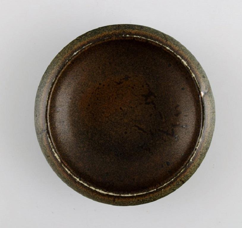 Carl Harry Ståhlane (1920-1990) for Rörstrand Atejle. 
Small bowl in glazed ceramics. Beautiful glaze in shades of brown. 1960s.
Measures: 11.5 x 4 cm.
In excellent condition.
Stamped.
1st factory quality.