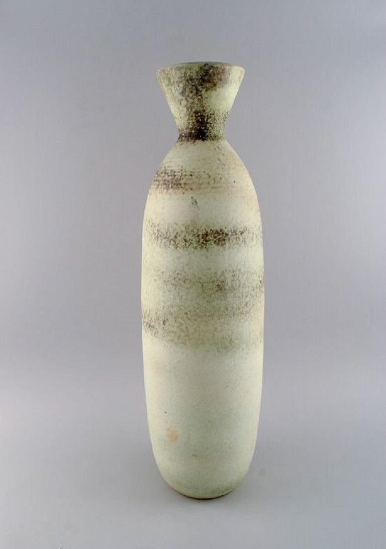 Carl Harry Ståhlane (1920-1990) for Rörstrand. 
Colossal vase in glazed ceramics. Beautiful glaze in light earth tones. 
Mid-20th century.
Measures: 62 x 18 cm.
In excellent condition.
Signed.
2nd factory quality.