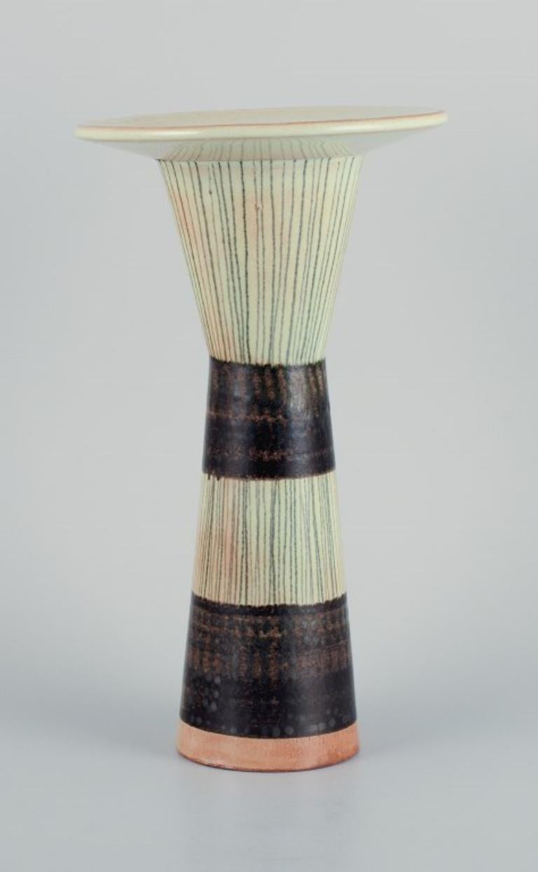 Carl Harry Ståhlane (1920-1990) for Rörstrand.
Tall ceramic vase with stripes.
1960s.
First factory quality.
In perfect condition.
Signed.
Dimensions: D 15.0 x H 26.0 cm.