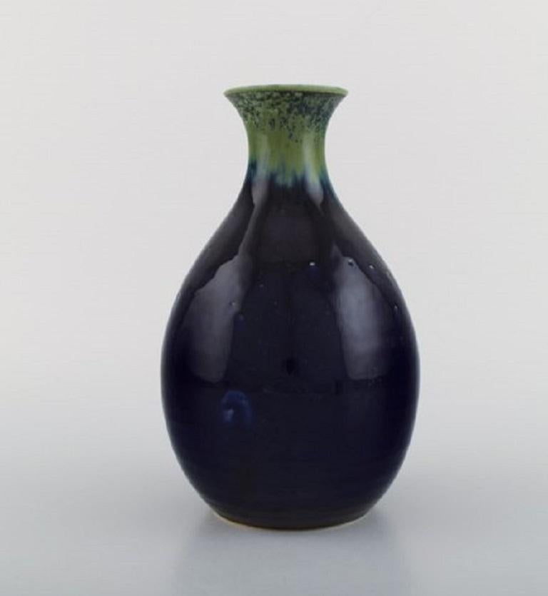 Carl Harry Stålhane (1920-1990) for Designhuset. Vase in glazed ceramics. 
Beautiful glaze in shades of green and blue. 1970s.
Measures: 21 x 13 cm.
In excellent condition.
Signed.