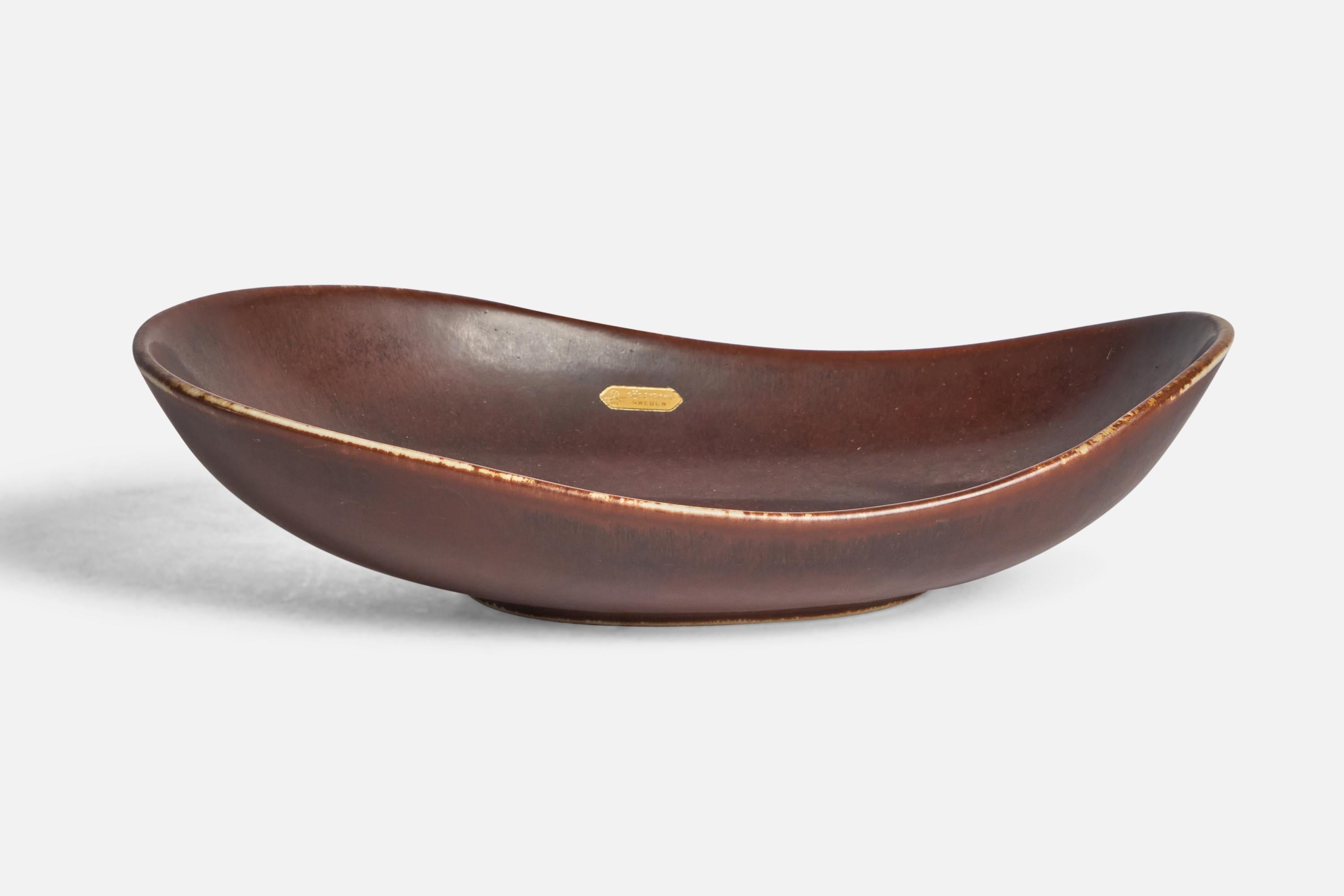 An organic brown-glazed stoneware bowl designed by Carl-Harry Stålhane and produced by Rörstrand, Sweden, 1950s.

“RÖRSTRAND SWEDEN” sticker. 