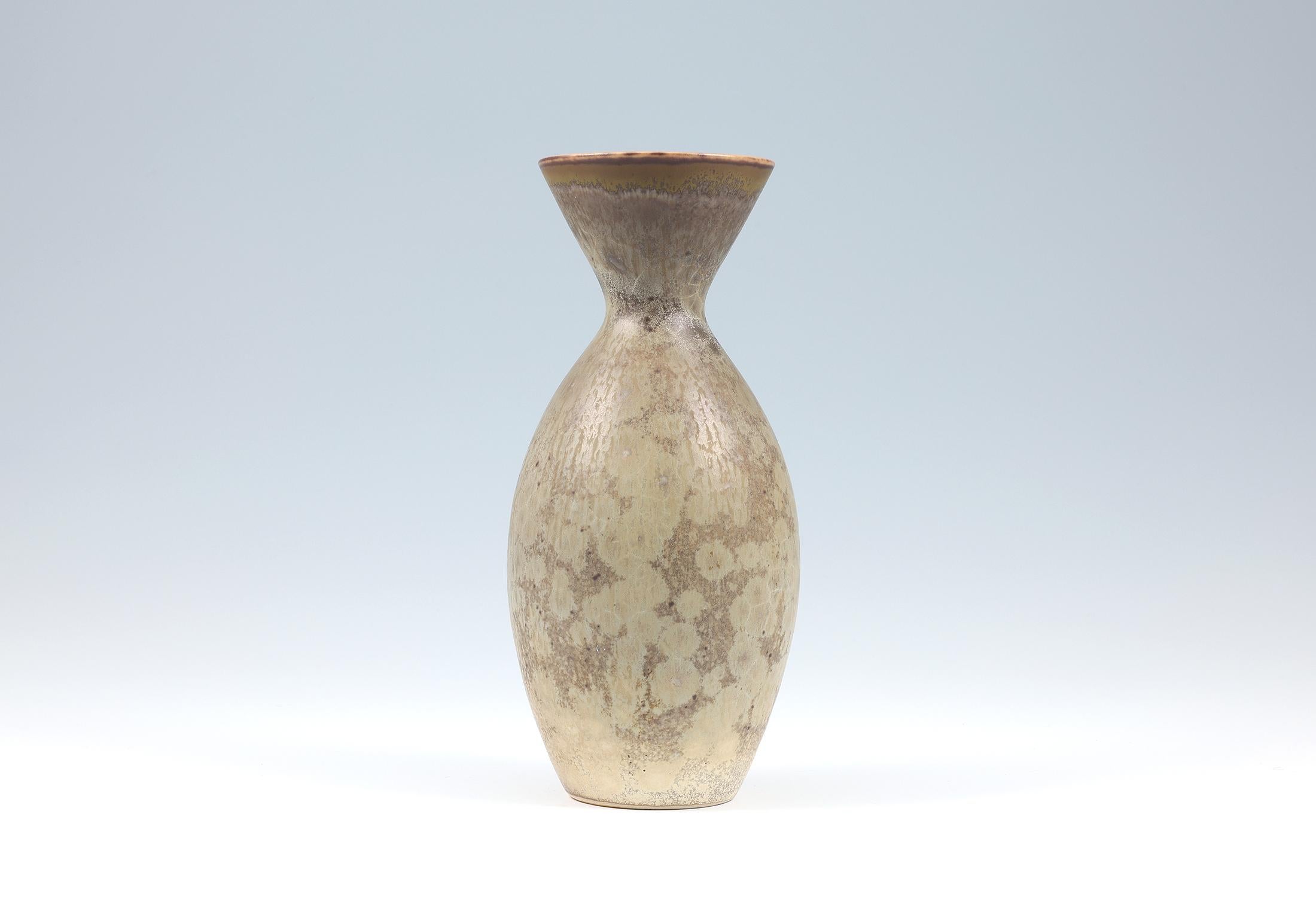 Carl-Harry Stålhane, Stoneware vase with crystale glaze, Rörstrand, Sweden 1950's Impressed Rörstrand R three crowns CHS SWEDEN

The entire surface of the vase is covered with a thin brown glazed surface, which is then covered with a double layer of
