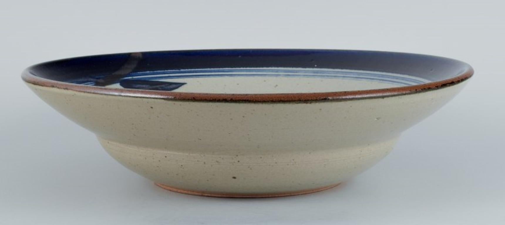 Carl Harry Stålhane for Designhuset.
Large bowl in earthenware with blue and light glaze.
1970s.
In perfect condition.
Signed.
Dimensions: D 33.0 x H 8.5 cm.