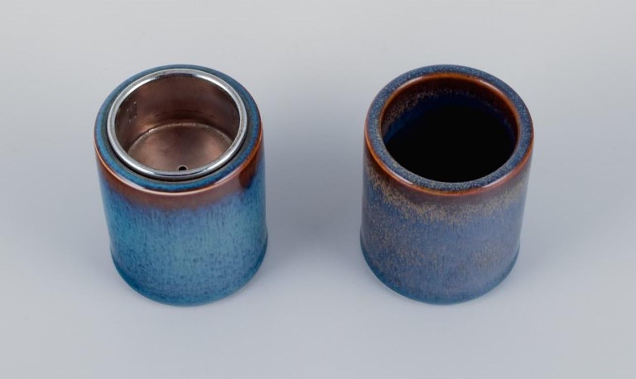 Carl Harry Stålhane for Rörstrand. A pair of ceramic vases with blue glaze.
Mid-20th century.
Marked.
First factory quality.
In excellent condition. One vase with metal insert.
Dimensions: H 6.8 cm x D 5.5 cm.