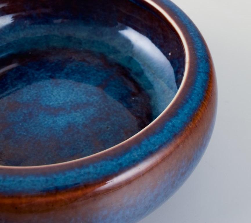Swedish Carl Harry Stålhane for Rörstrand. Ceramic bowl in blue-brown shades For Sale
