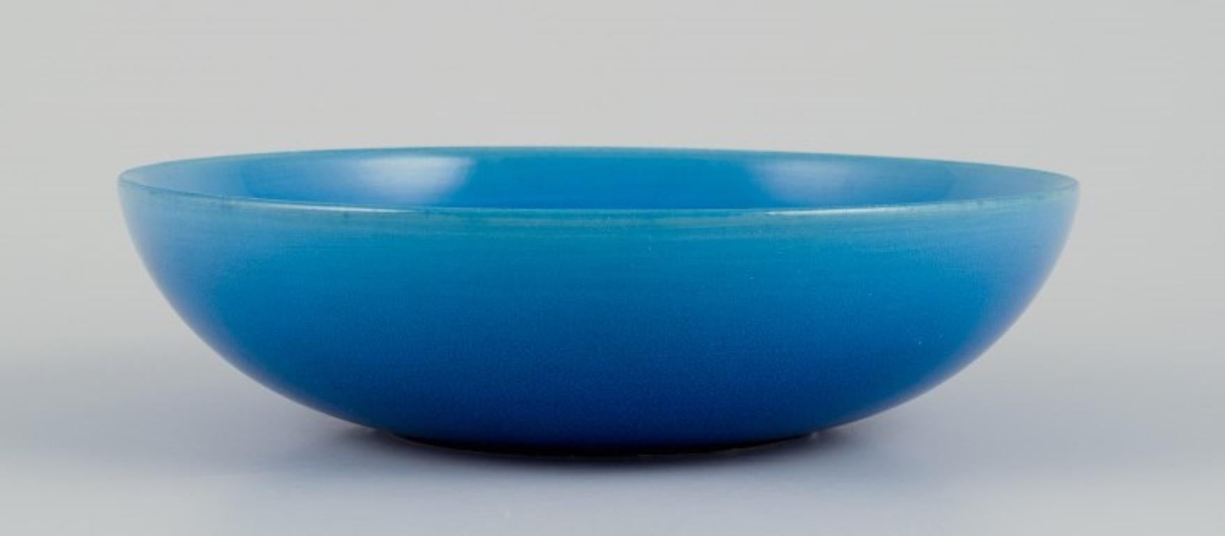 Carl Harry Stålhane (1920-1990) for Rörstrand, Sweden. 
Ceramic bowl in turquoise glaze.
Mid-20th century.
Marked.
In perfect condition with natural crackling.
Second factory quality.
Dimensions: Diameter 18.0 cm x Height 4.5 cm.