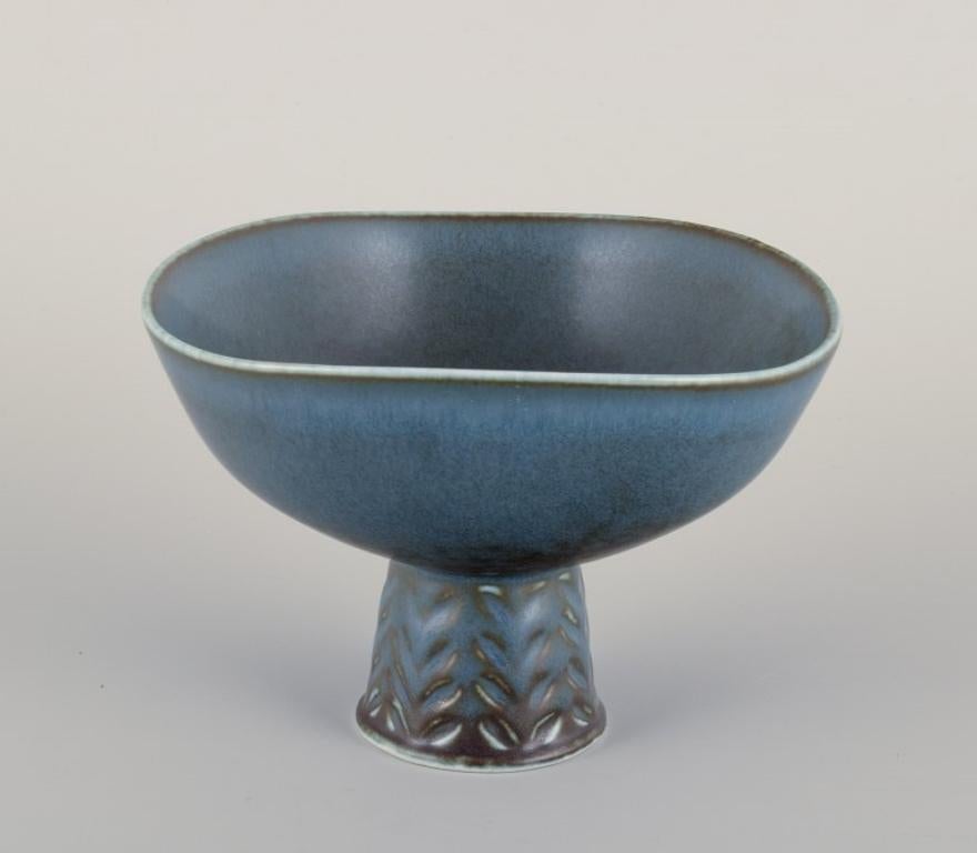 Carl Harry Stålhane (1920-1990) for Rörstrand, Sweden. 
Ceramic bowl on a pedestal.
Glaze in blue tones.
Mid-20th century.
Marked.
First factory quality.
In perfect condition.
Dimensions: Diameter 13.9 cm x Height 9.5 cm.

Carl-Harry Stålhane is