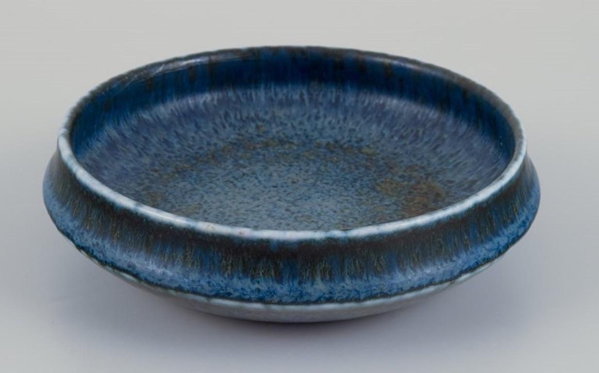 Scandinavian Modern Carl Harry Stålhane for Rörstrand. Ceramic bowl with blue-toned glaze For Sale