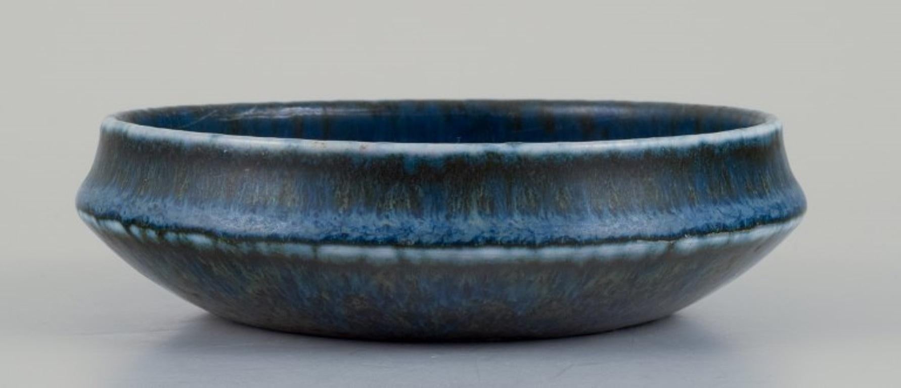 Swedish Carl Harry Stålhane for Rörstrand. Ceramic bowl with blue-toned glaze For Sale