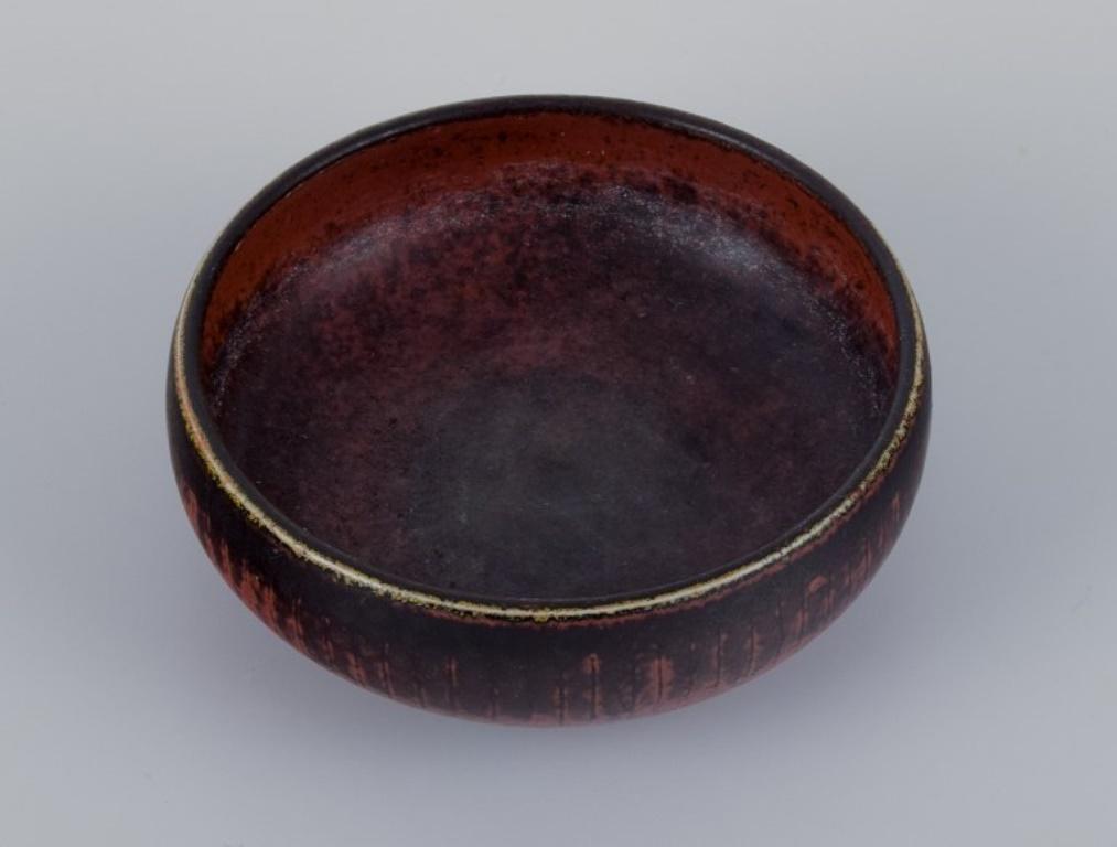 Carl-Harry Stålhane for Rörstrand, ceramic bowl with glaze in brown tones.
From the 1960s.
Marked.
Perfect condition.
First factory quality.
Dimensions: D 12.0 cm. x H 4.0 cm.