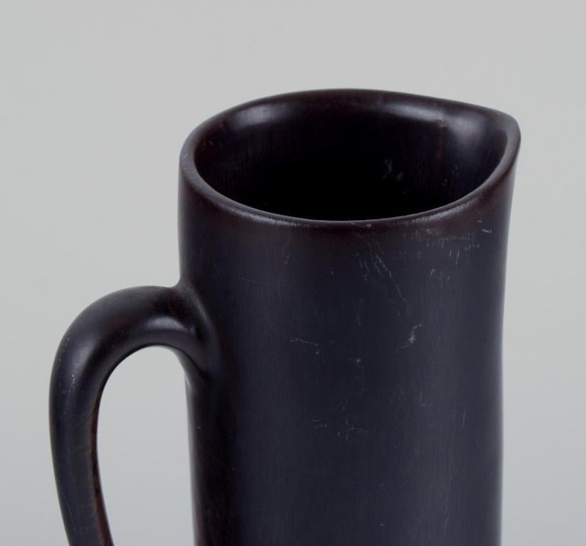 Glazed Carl Harry Stålhane for Rörstrand. Ceramic jug with glaze in dark brown shades.  For Sale