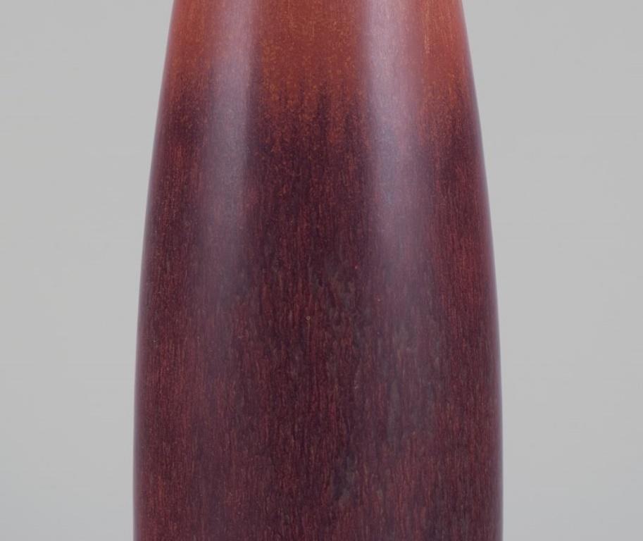 Swedish Carl Harry Stålhane for Rörstrand. Ceramic vase with glaze in brown shades For Sale