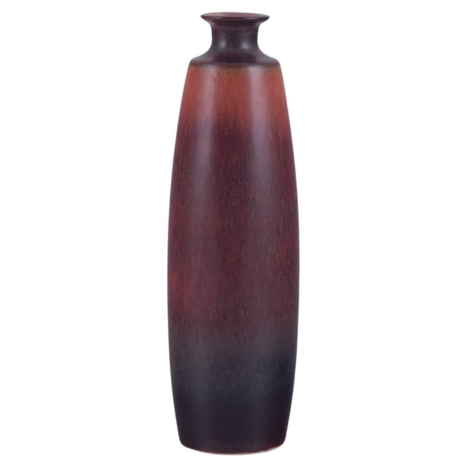 Carl Harry Stålhane for Rörstrand. Ceramic vase with glaze in brown shades For Sale