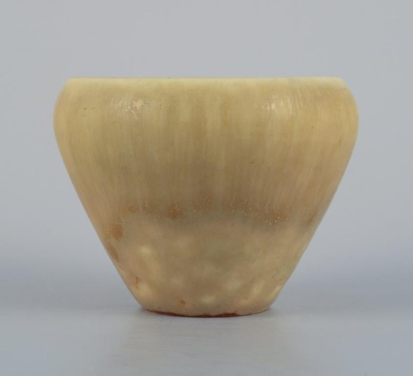 Carl-Harry Stålhane for Rörstrand.
Ceramic vase with hare fur glaze in shades of yellow.
Perfect condition.
Mid-20th century.
Signed.
Dimensions: H 6.0 x D 7.3 cm.