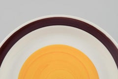 Carl Harry Stålhane for Rörstrand. Five deep "Solöga" (Sun Eye) dinner plates.