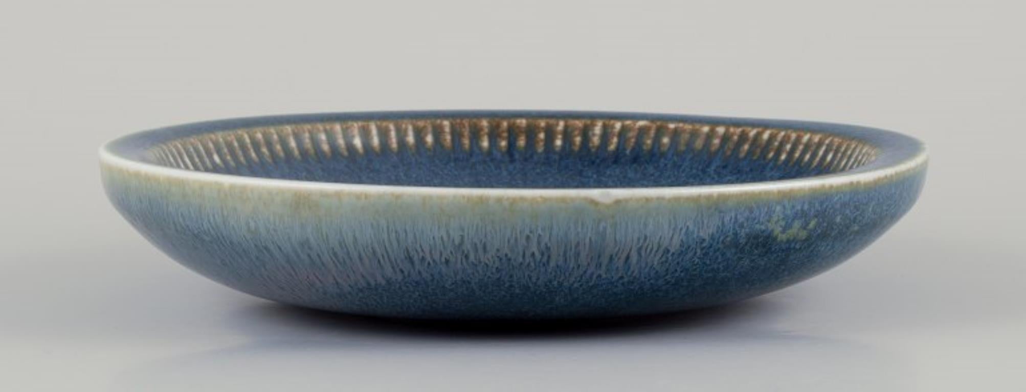 Scandinavian Modern Carl Harry Stålhane for Rörstrand. Large ceramic bowl. Glazed in blue shades.