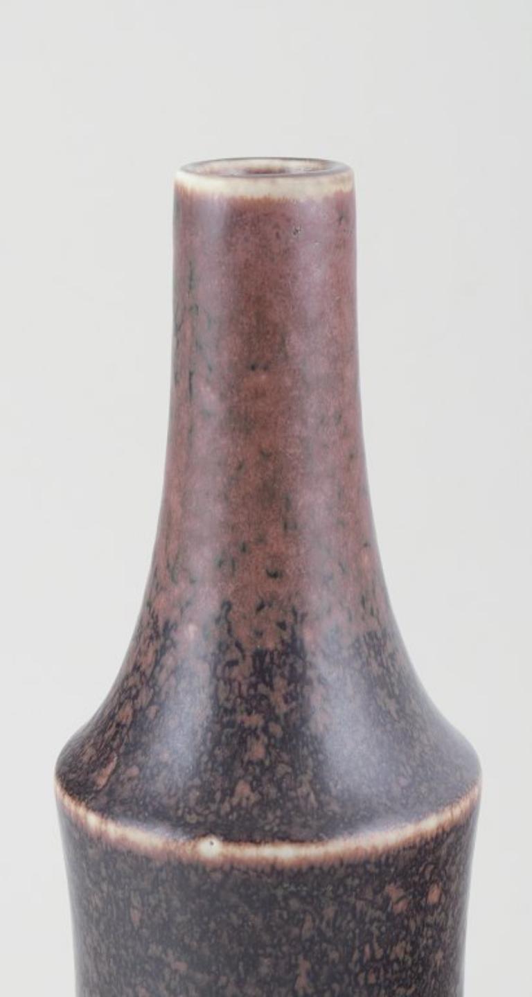PRE-OWNED GOODS ARE EXEMPT FROM IMPORT TARIFFS FOR U.S., UK, AUSTRALIAN & CANADIAN CUSTOMERS.   
THEREFORE, NO IMPORT TARIFFS WILL BE APPLICABLE TO YOUR PURCHASE. 

Carl Harry Stålhane for Rörstrand, Sweden.
Large ceramic vase. Slender shape with a
