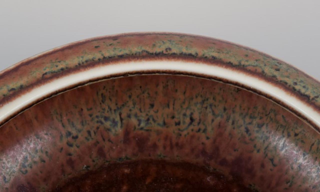 Glazed Carl Harry Stålhane for Rörstrand. Low ceramic bowl with brown and green glaze. For Sale