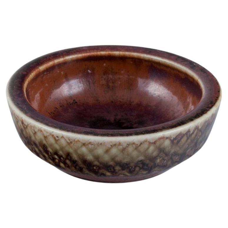Carl Harry Stålhane for Rörstrand. Miniature ceramic bowl in brown tones.