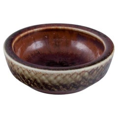 Carl Harry Stålhane for Rörstrand. Miniature ceramic bowl in brown tones.