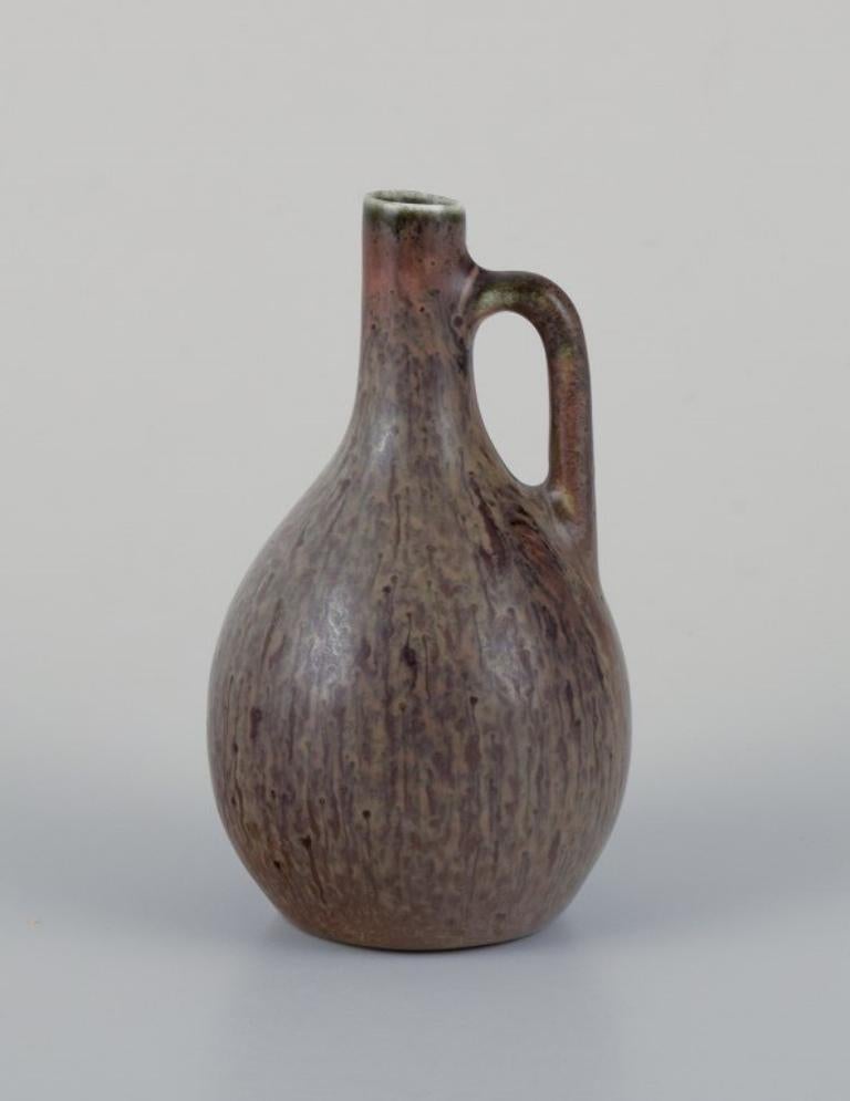 Carl Harry Stålhane for Rörstrand, miniature pitcher/vase in green-brown hues.
Mid-20th century.
Marked.
In perfect condition.
Second factory quality.
Dimensions: H 7.2 cm x D 3.8 cm.