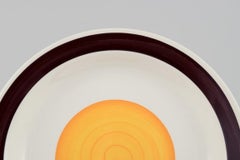 Carl-Harry Stålhane per Rörstrand. Set di otto piatti "Solöga" (occhio del sole).