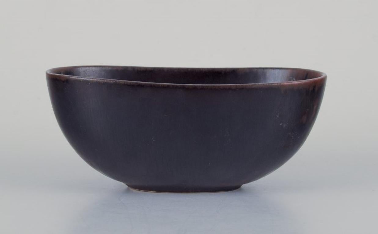 Swedish Carl Harry Stålhane for Rörstrand. Small ceramic bowl in dark brown shades.  For Sale