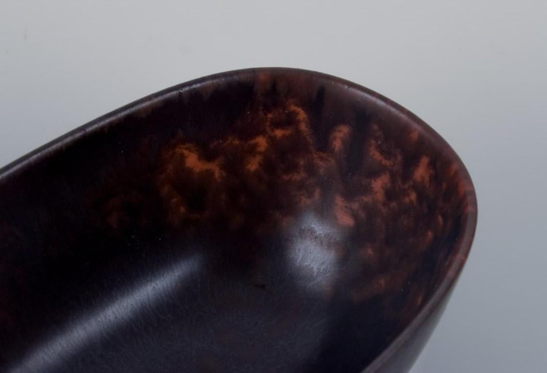 Glazed Carl Harry Stålhane for Rörstrand. Small ceramic bowl in dark brown shades.  For Sale