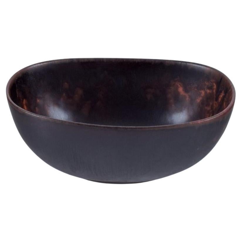 Carl Harry Stålhane for Rörstrand. Small ceramic bowl in dark brown shades.  For Sale