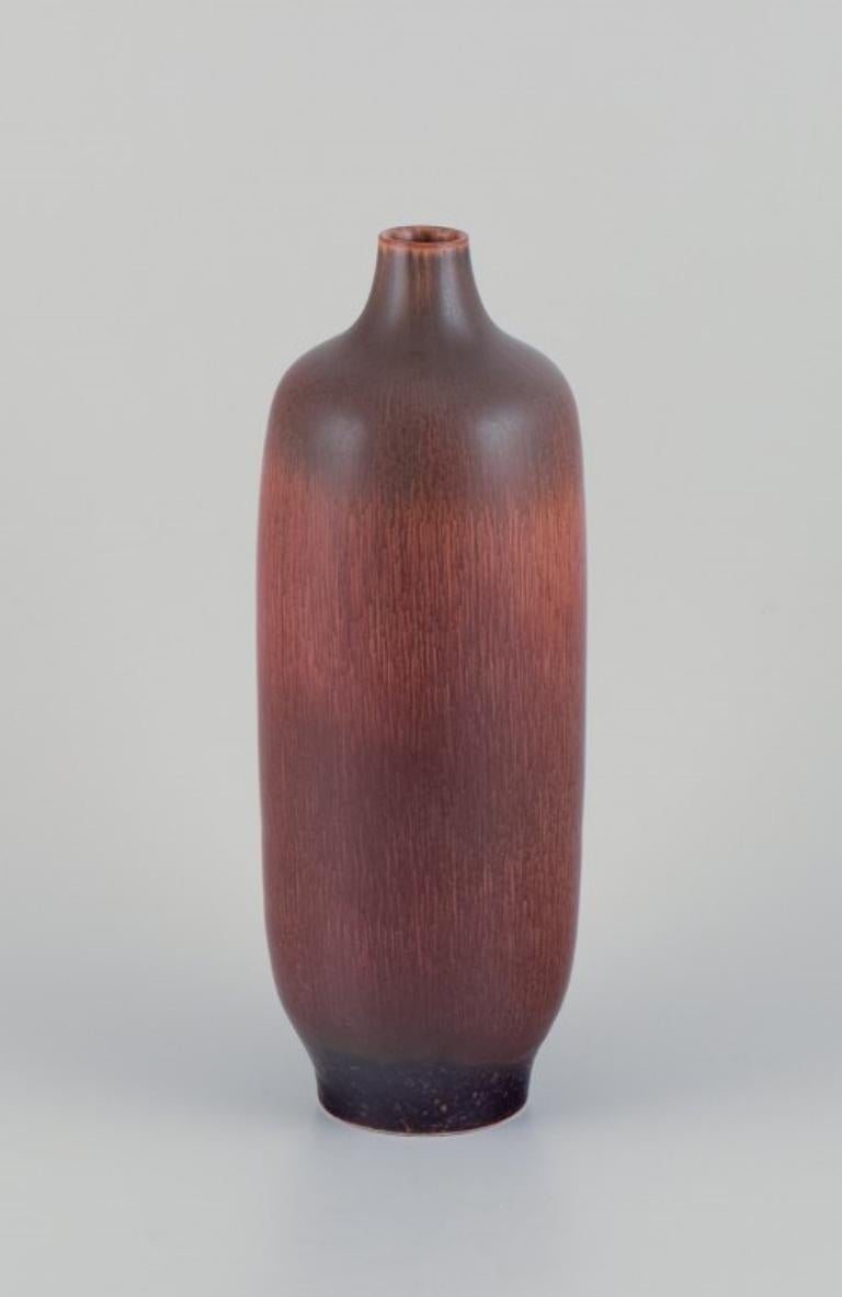 Carl Harry Stålhane (1920-1990) for Rörstrand, Sweden. 
Large vase in hare's fur glaze with brown tones.
1950s.
In perfect condition.
Second factory quality.
Dimensions: H 37.0 cm x D 13.0 cm.

Carl-Harry Stålhane is widely recognized as a prominent