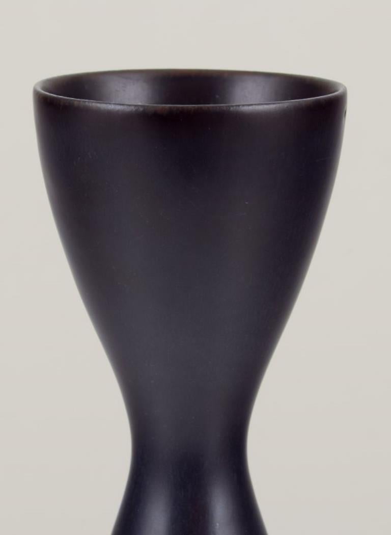 Carl Harry Stålhane (1920-1990) for Rörstrand, Sweden.
Slim ceramic vase in a modernist style. Black glaze.
Mid-20th century.
Marked.
In excellent condition with minimal production flaw at the top. See photo.
Second factory quality.
Dimensions: H