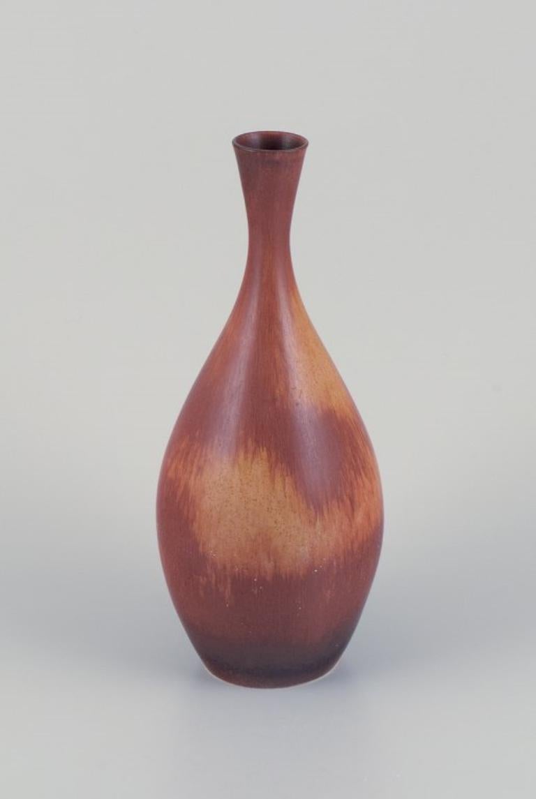 Carl Harry Stålhane (1920-1990) for Rörstrand, Sweden. 
Vase in hare's fur glaze. Dark and sandy hues.
1950s.
In perfect condition.
First factory quality.
Dimensions: H 29.0 cm x D 11.0 cm.

Carl-Harry Stålhane is widely recognized as a prominent
