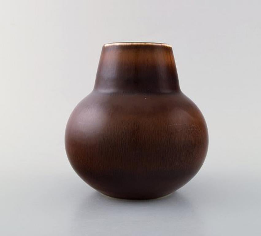 Carl-Harry Stålhane for Rørstrand. Ceramic vase decorated with beautiful glaze in brown shades. 1950s.
Measures 16 x 15 cm.
In perfect condition.
1st factory quality.
Signed.