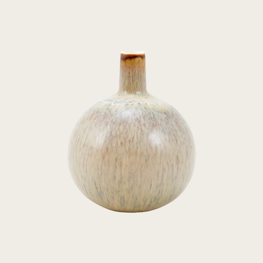 1950s, Sweden. A glossy glaze in beige, blue, and violet-brown tones with modernist globular form. Designer and manufacturer marked on underside.