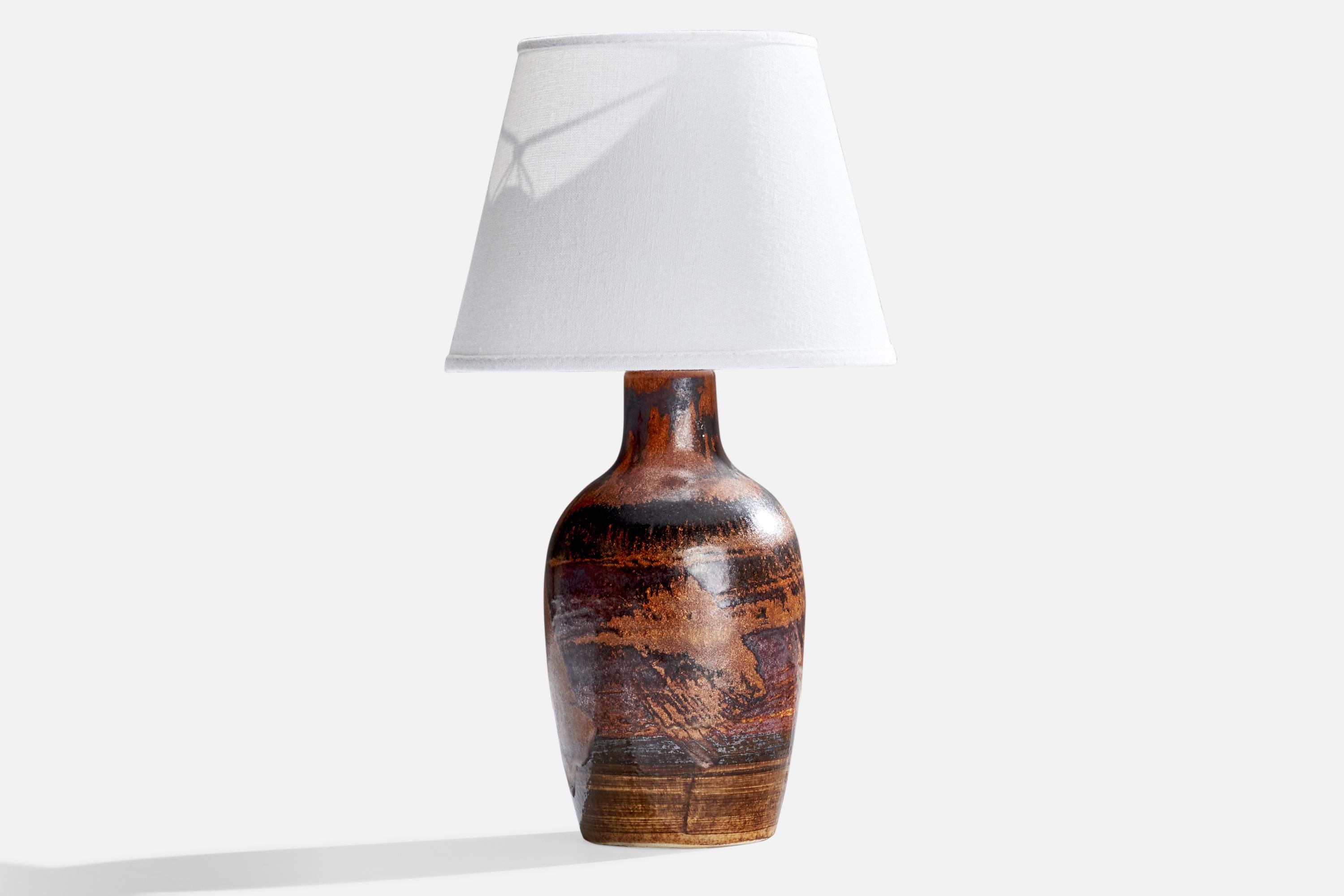 A black and brown-glazed stoneware table lamp designed by Carl-Harry Stålhane and Kent Ericsson, produced by Designhuset, Sweden, 1960s.

Dimensions of Lamp (inches): 10.75” H x 4.5”  Diameter
Dimensions of Shade (inches): 5” Top Diameter x 8”