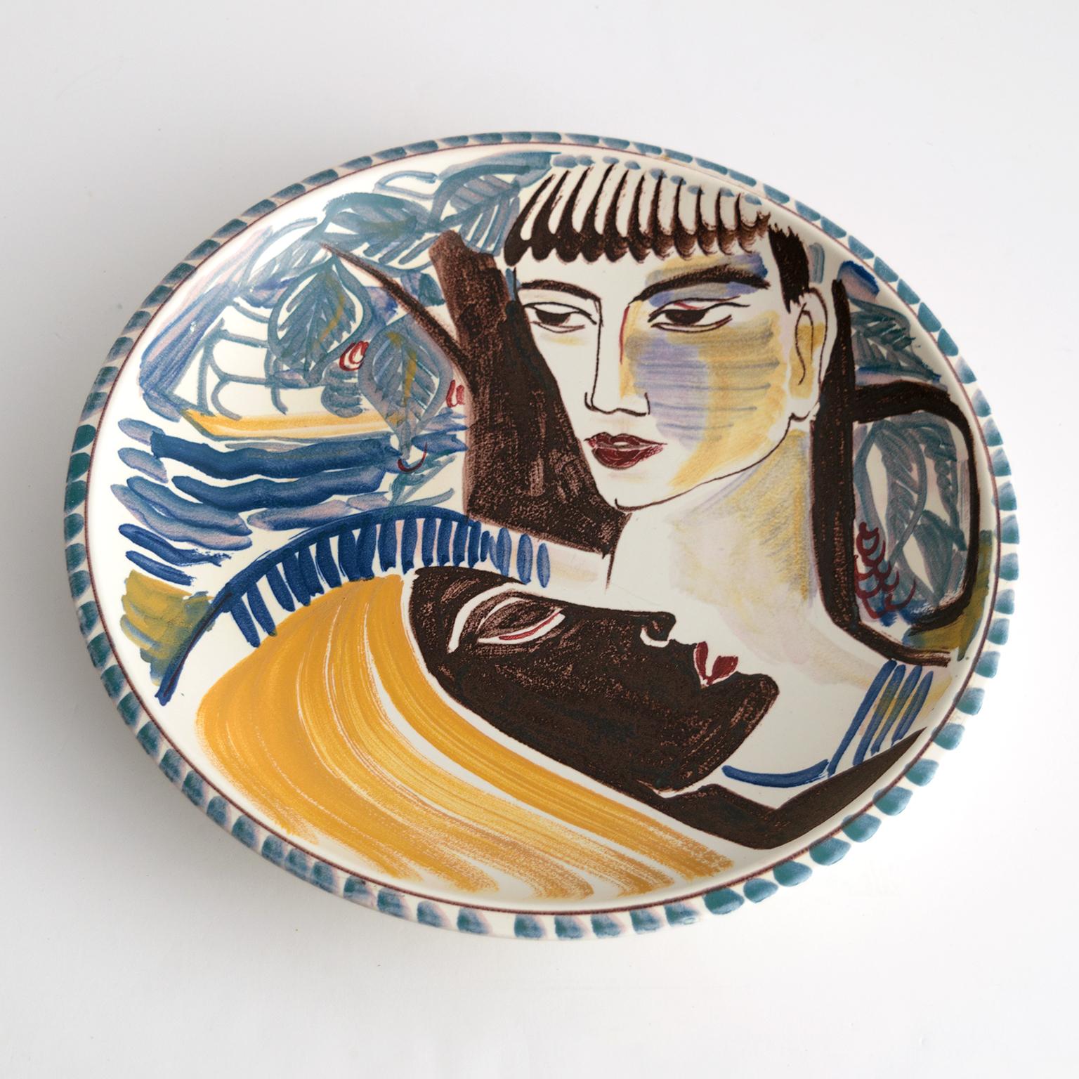 Carl-Harry Stålhane hand decorated stoneware bowl designed at Rorstrand, Sweden. The bowl depicts the faces of two women one of which is reclining. Signed and dated (1943) on the bottom. 

Measures: Diameter 15”, height 2.5”.