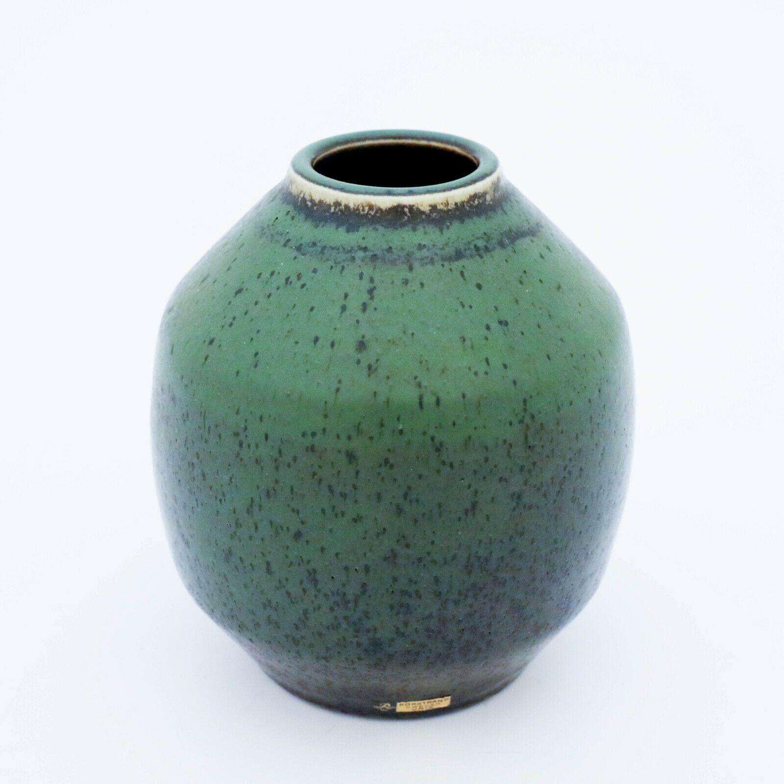 A green midcentury Swedish vase in stoneware by Rörstrand, designed by Carl-Harry Stålhane. This unique vase has an excellent glaze and is in very good vintage condition.