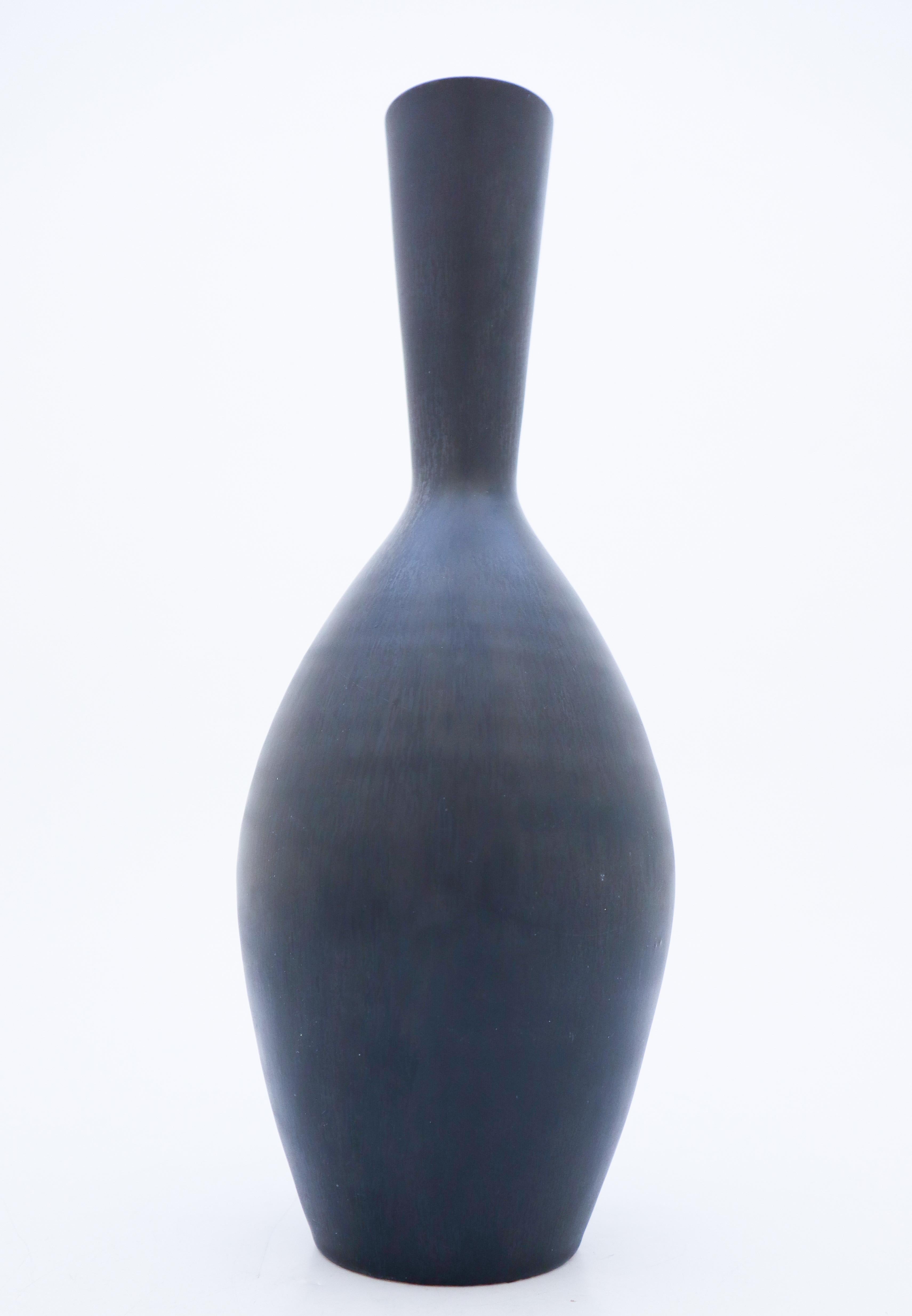 A beautiful midcentury Swedish vase in stoneware by Rörstrand, designed by Carl-Harry Stålhane. The vase is marked as 2nd quality because of some blurriness in the glaze around the neck.