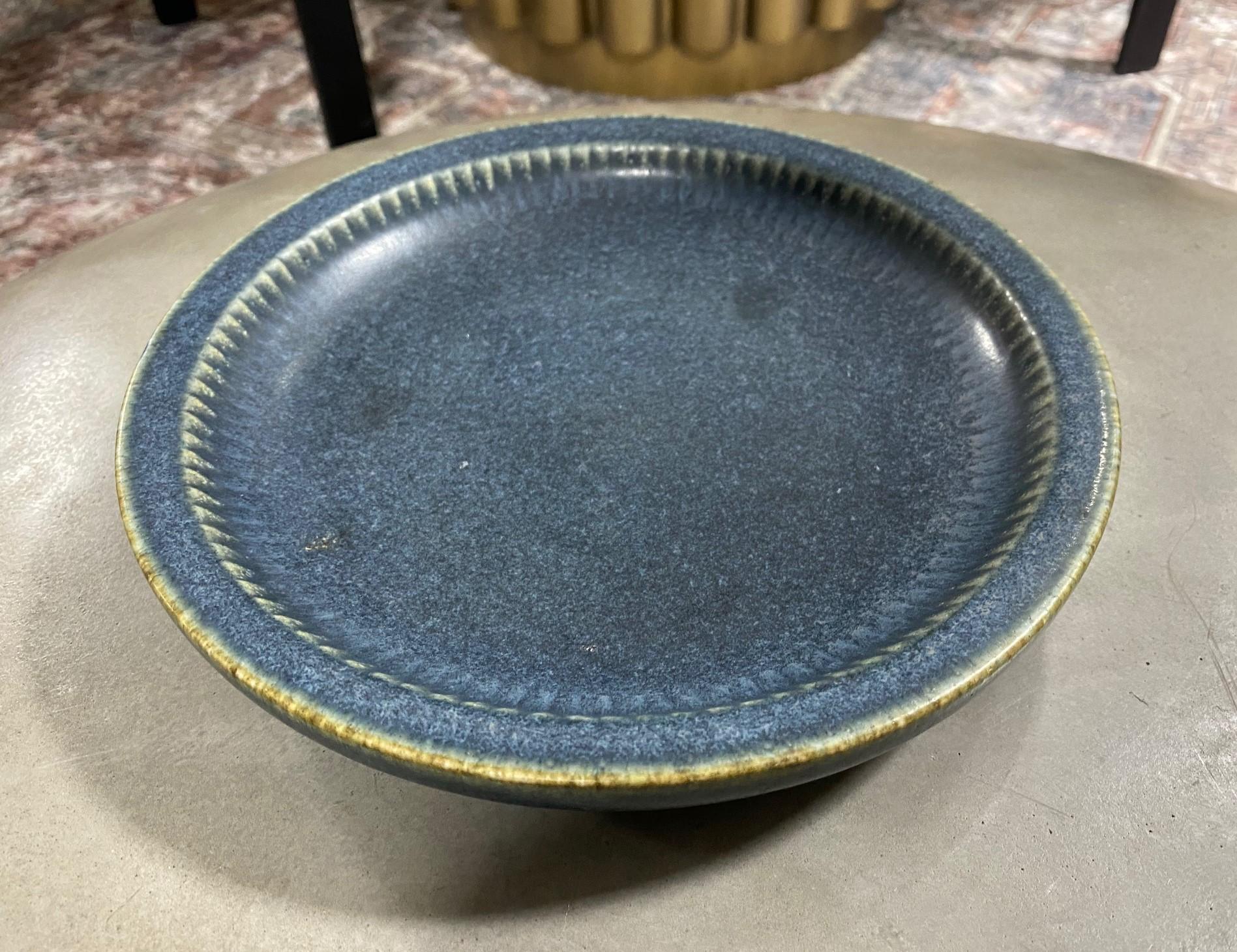 A beautifully designed, richly, and deeply blue-colored/ glazed ceramic bowl by famed Swedish designer Carl-Harry Stålhane for Rörstrand, Sweeden. The craftsmanship and color are stunning.

Carl-Harry Stalhane (1920-90) was one of the leading