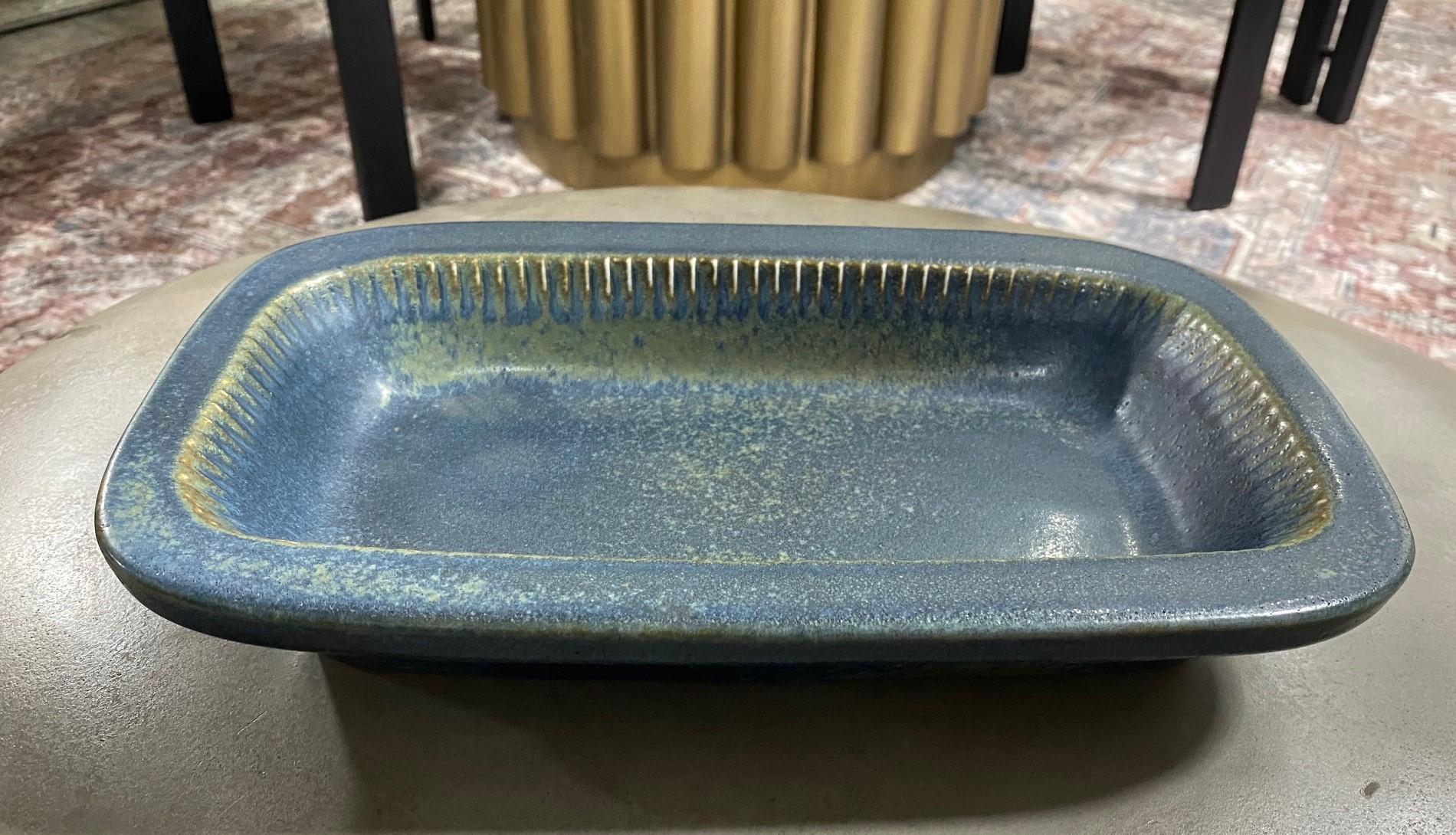 A beautifully designed, richly, and deeply blue-colored / glazed ceramic large bowl / tray by famed Swedish designer Carl-Harry Stålhane for Rörstrand, Sweden. The craftsmanship and color are stunning. A quite hefty and sizeable work.

Carl-Harry