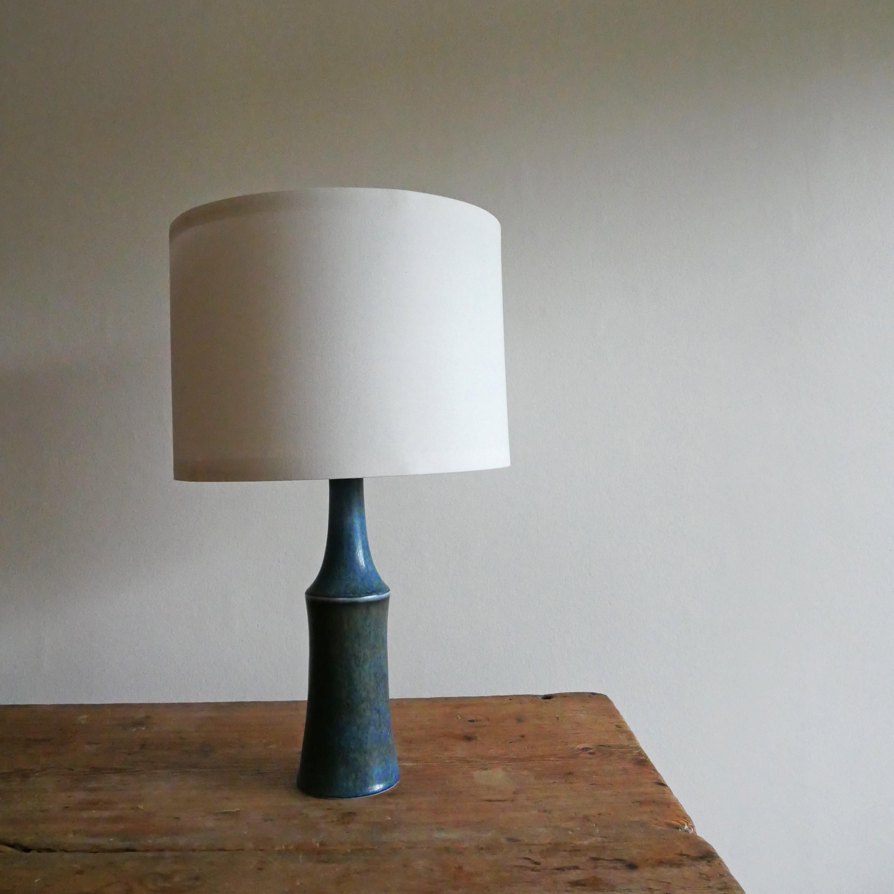 One table lamp made by Carl-Harry Stålhane for the iconic Swedish, Rörstrand. Features highly artistic blue glaze with a touch of green tones.


Height: 30 cm
Diameter:  10 cm
Height includes socket: 35 cm

Do not includes lampshades.

