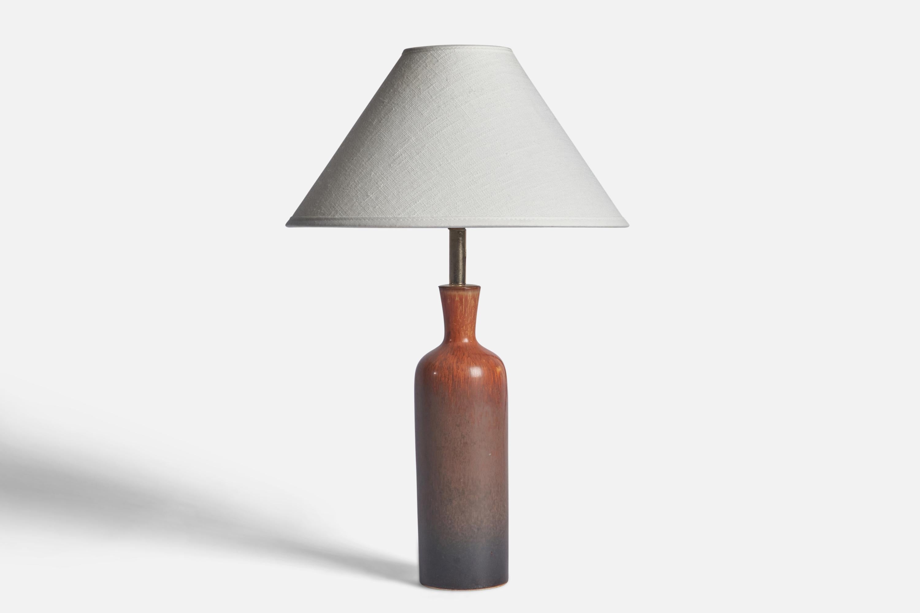 A brown and grey-glazed stoneware and brass table lamp designed by Carl-Harry Stålhane and produced by Rörstrand, Sweden, 1950s.

Dimensions of Lamp (inches): 12” H x 2.5” Diameter
Dimensions of Shade (inches): 2.5” Top Diameter x 10” Bottom