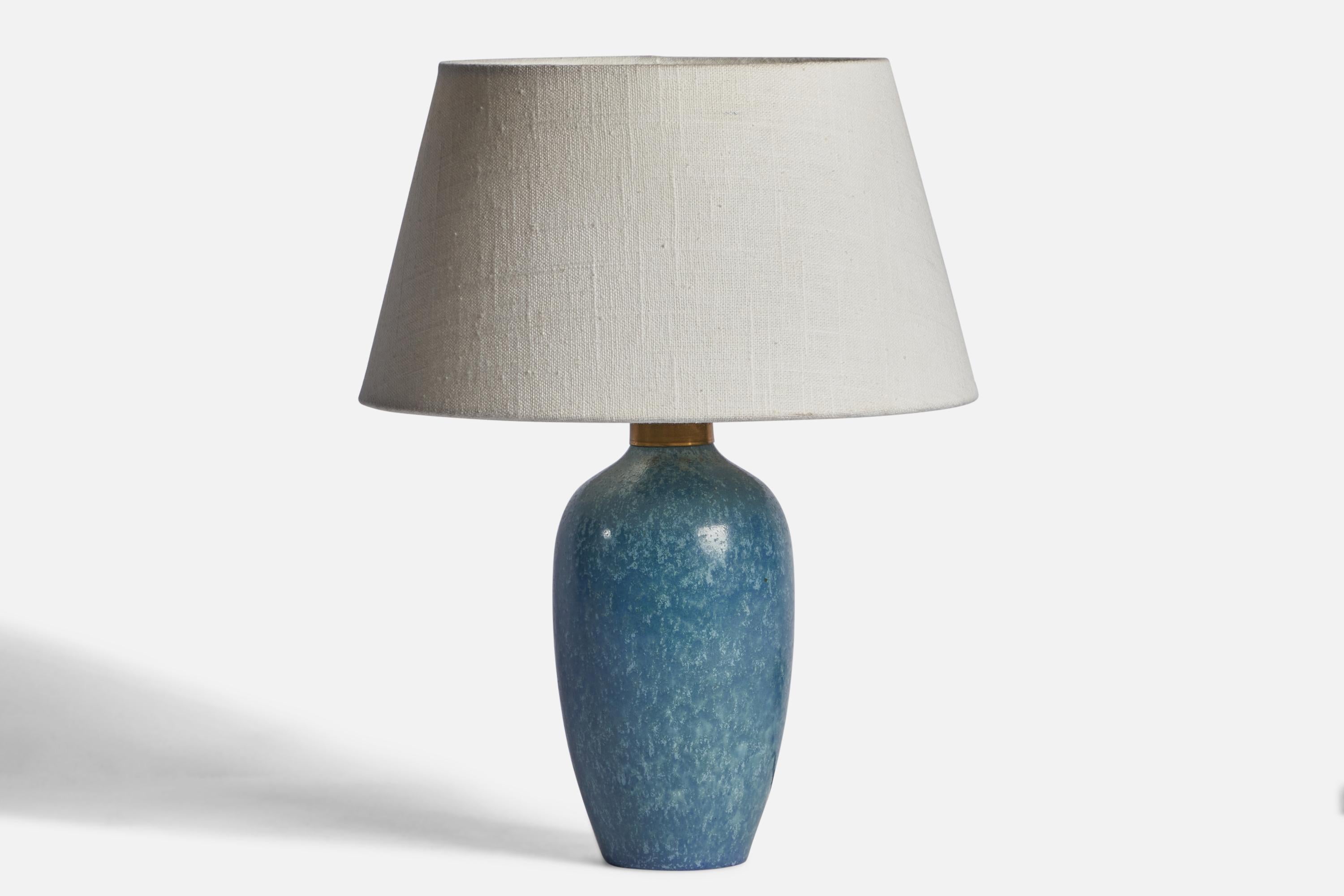 
A blue-glazed stoneware and brass table lamp designed by Carl-Harry Stålhane and produced by Rörstrand, Sweden, 1950s.
Dimensions of Lamp (inches): 9.75” H x 3.90” Diameter
Dimensions of Shade (inches): 7” Top Diameter x 10” Bottom Diameter x 5.5”