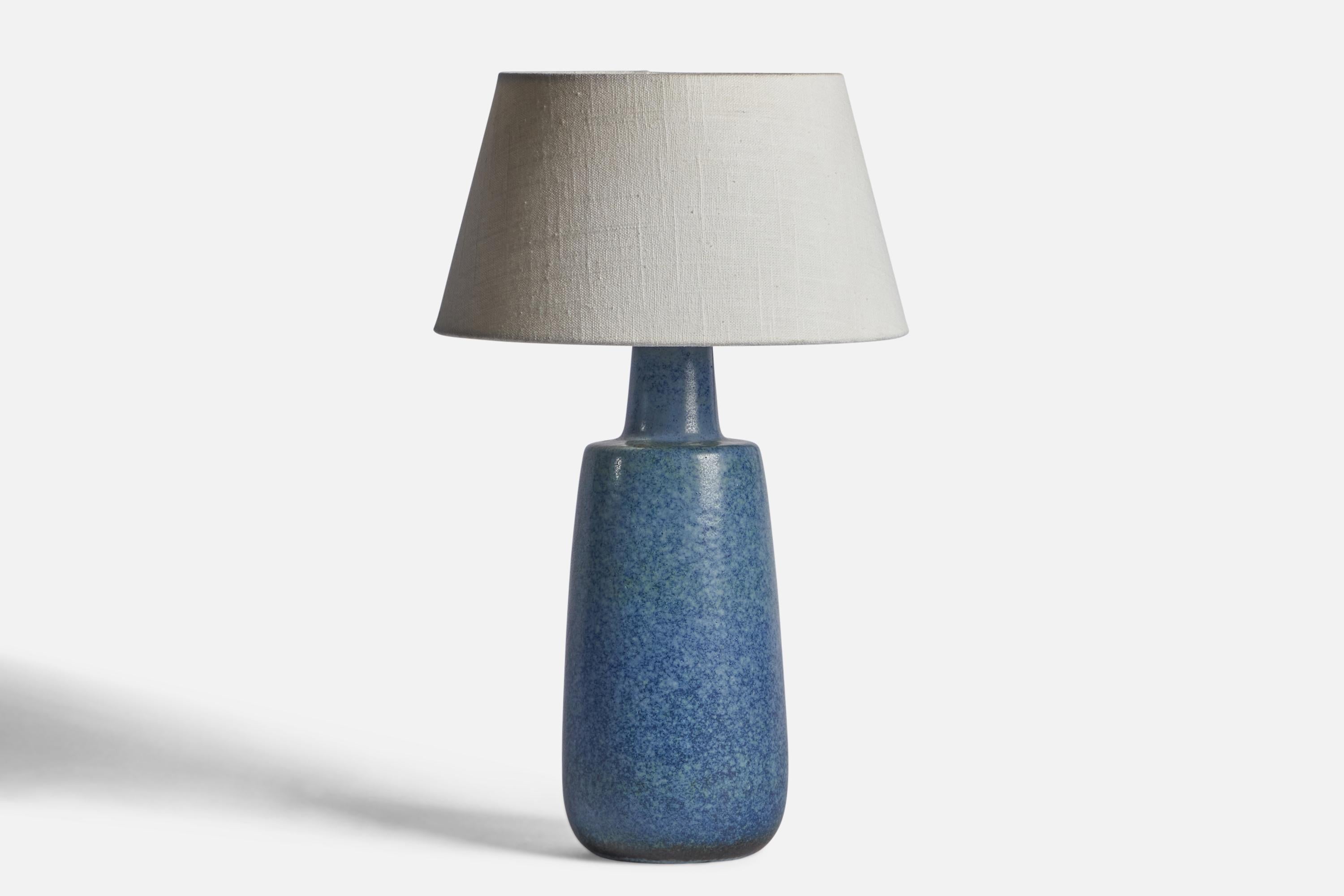 A blue-glazed stoneware table lamp designed by Carl-Harry Stålhane and produced by Rörstrand, Sweden, 1950s.

Dimensions of Lamp (inches): 13.6” H x 4.75” Diameter
Dimensions of Shade (inches): 7” Top Diameter x 10” Bottom Diameter x 5.5” H