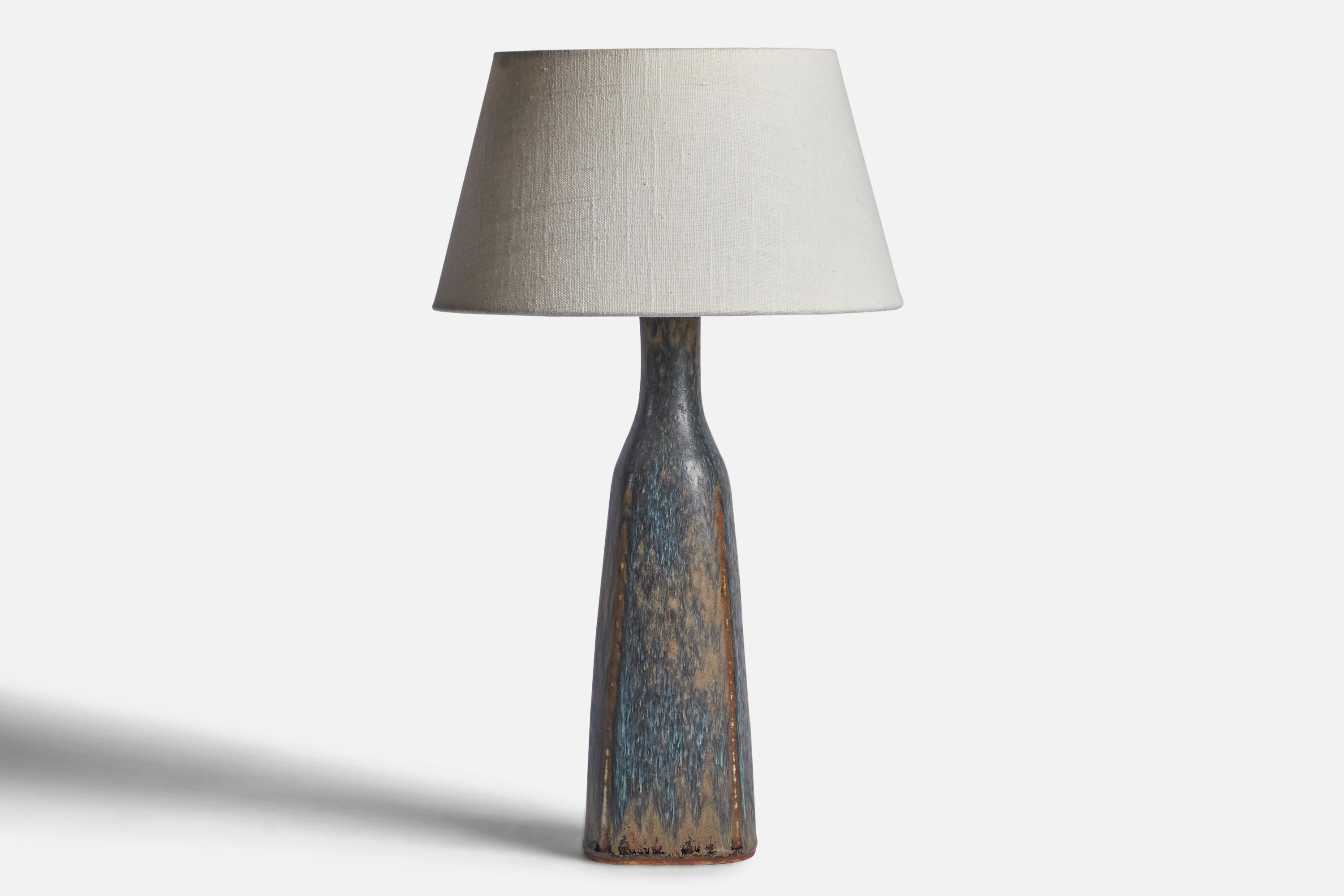A black, blue and brown-glazed stoneware table lamp designed by Carl-Harry Stålhane and produced by Rörstrand, Sweden, 1950s.

Dimensions of Lamp (inches): 14.15” H x 3.75” Diameter
Dimensions of Shade (inches): 7” Top Diameter x 10” Bottom Diameter