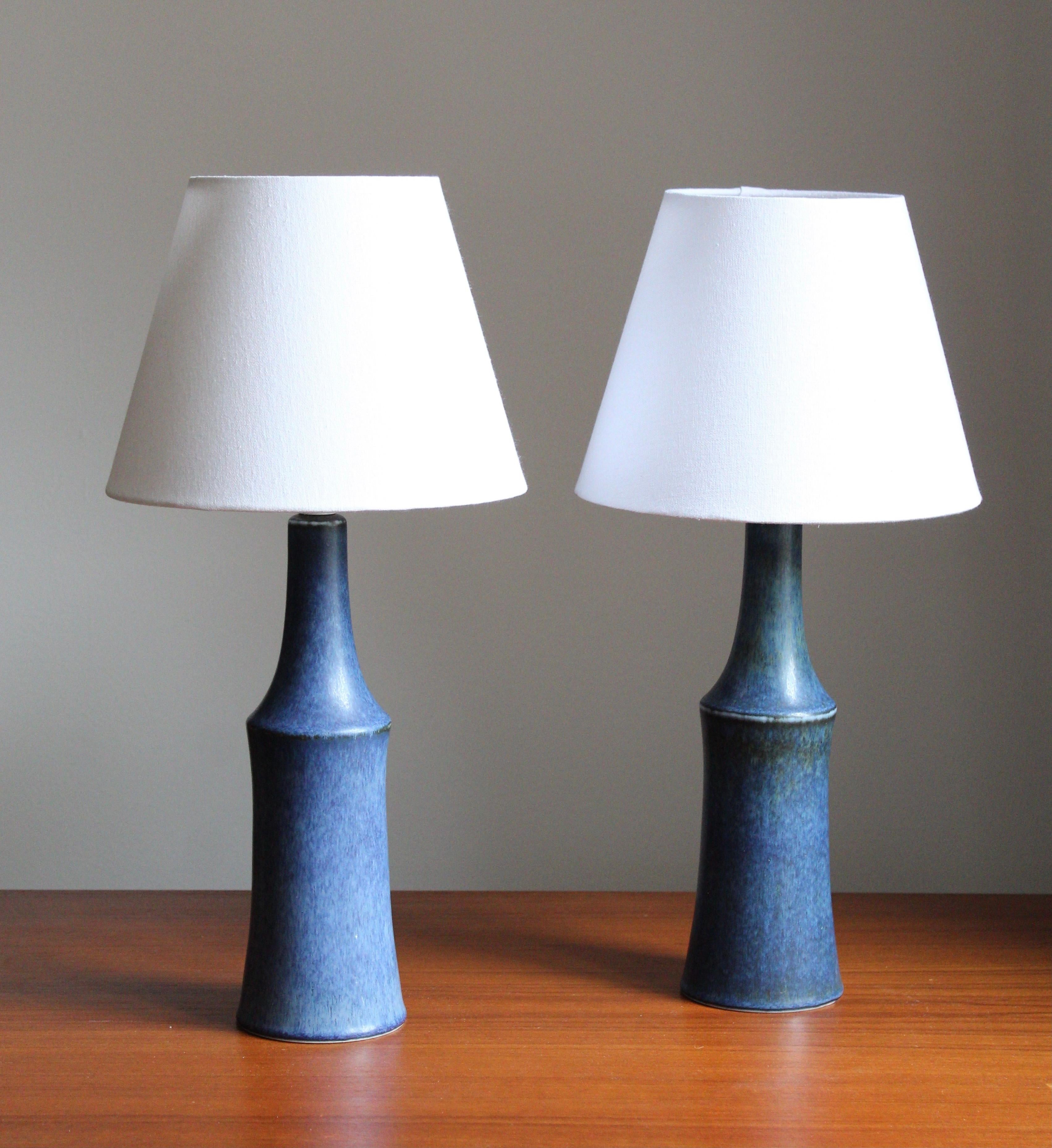 A pair of rare table lamps by Carl-Harry Stålhane for the iconic Swedish firm Rörstrand. Features highly artistic blue glaze. Sold without lampshades.


Other ceramicists of the period include Berndt Friberg, Axel Salto, and Wilhelm Kåge, Lucie Rie,