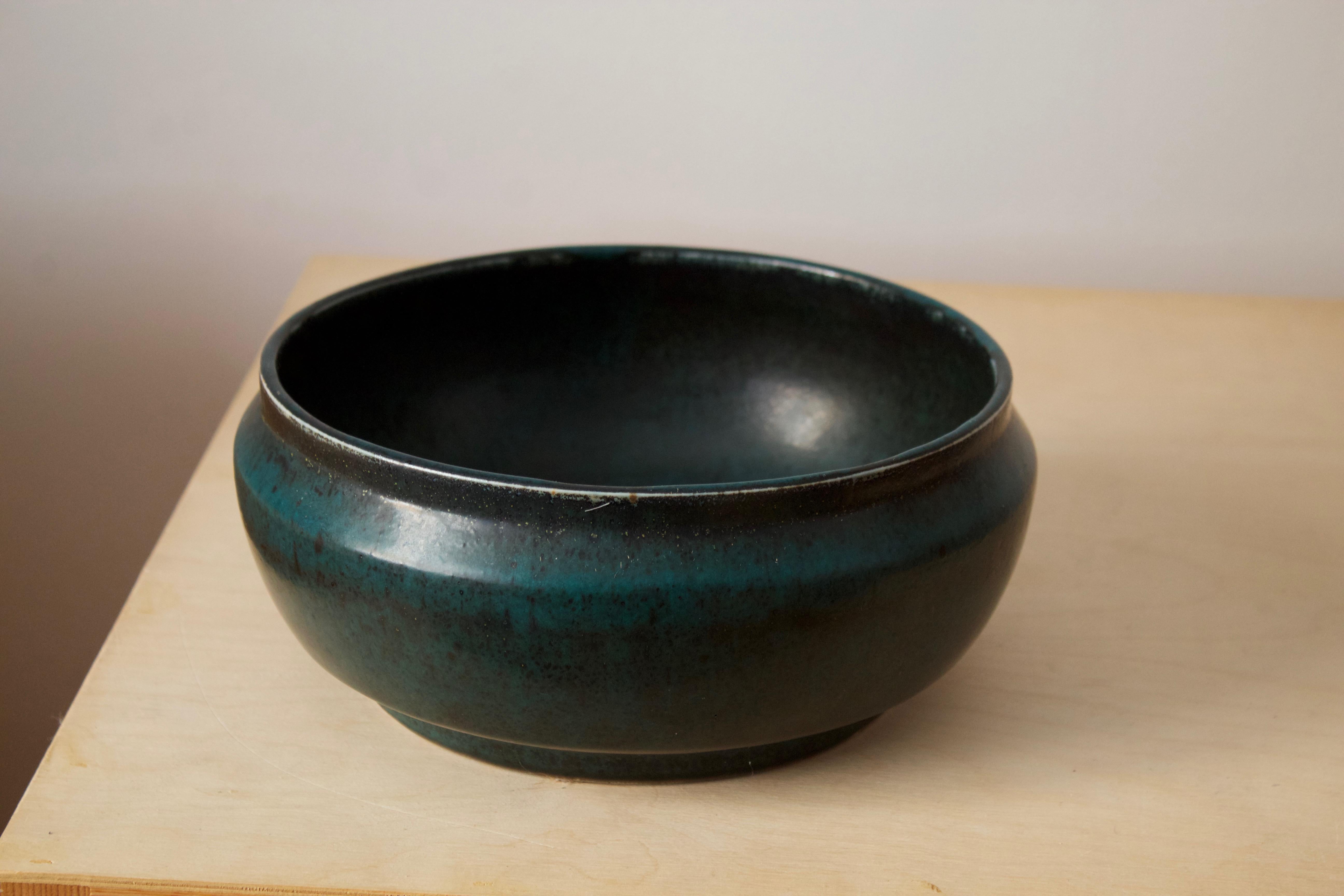 A stoneware bowl with unique glaze designed by Carl-Harry Stålhane produced by Rörstrand, signed, circa 1960s.

From production series at Rörstands named 