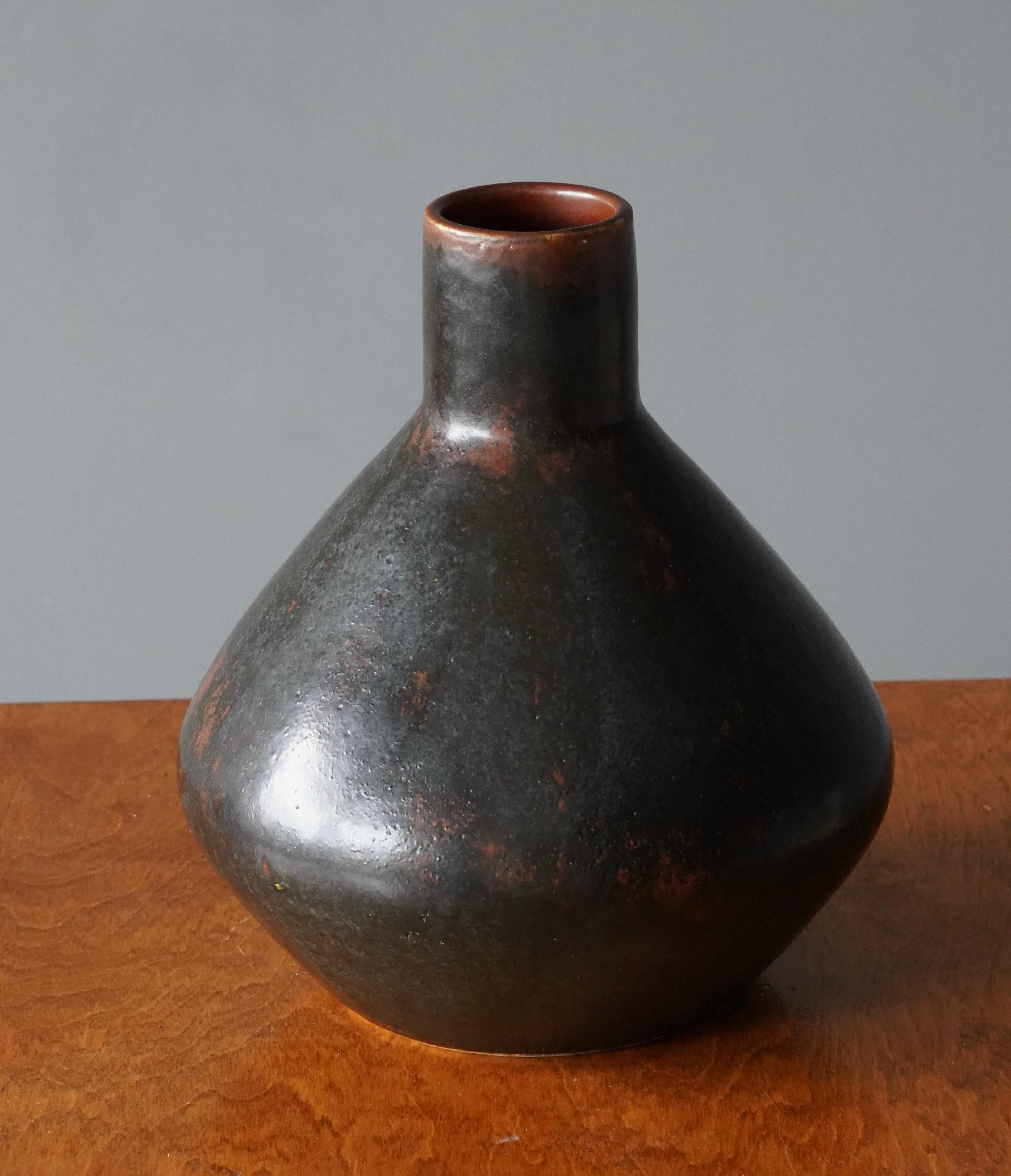 A unique studio vase by Carl-Harry Stålhane.

Part of a small scale production of unique works developed by the art department at the Swedish ceramic producer Rörstrand. The hand of the artist was highly involved in the execution of the unique