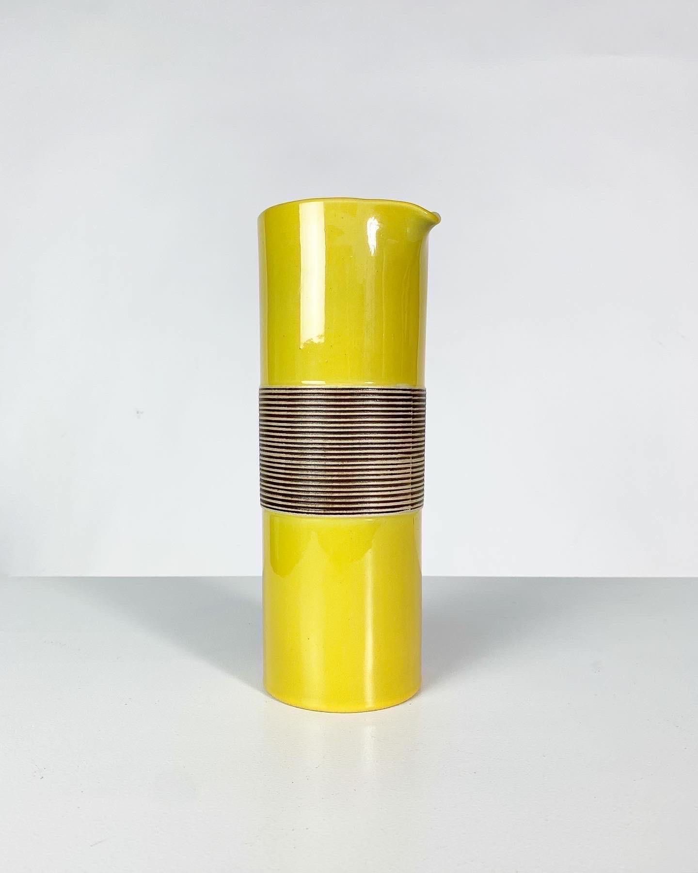 Ceramic carafe designed by Carl Harry Stålhane, „Entré“ series designed in 1957 for Rörstrand in Sweden and produced until 1960.

The series consists of different tableware in unicolor glazes with a carved relief detail, this piece comes in a